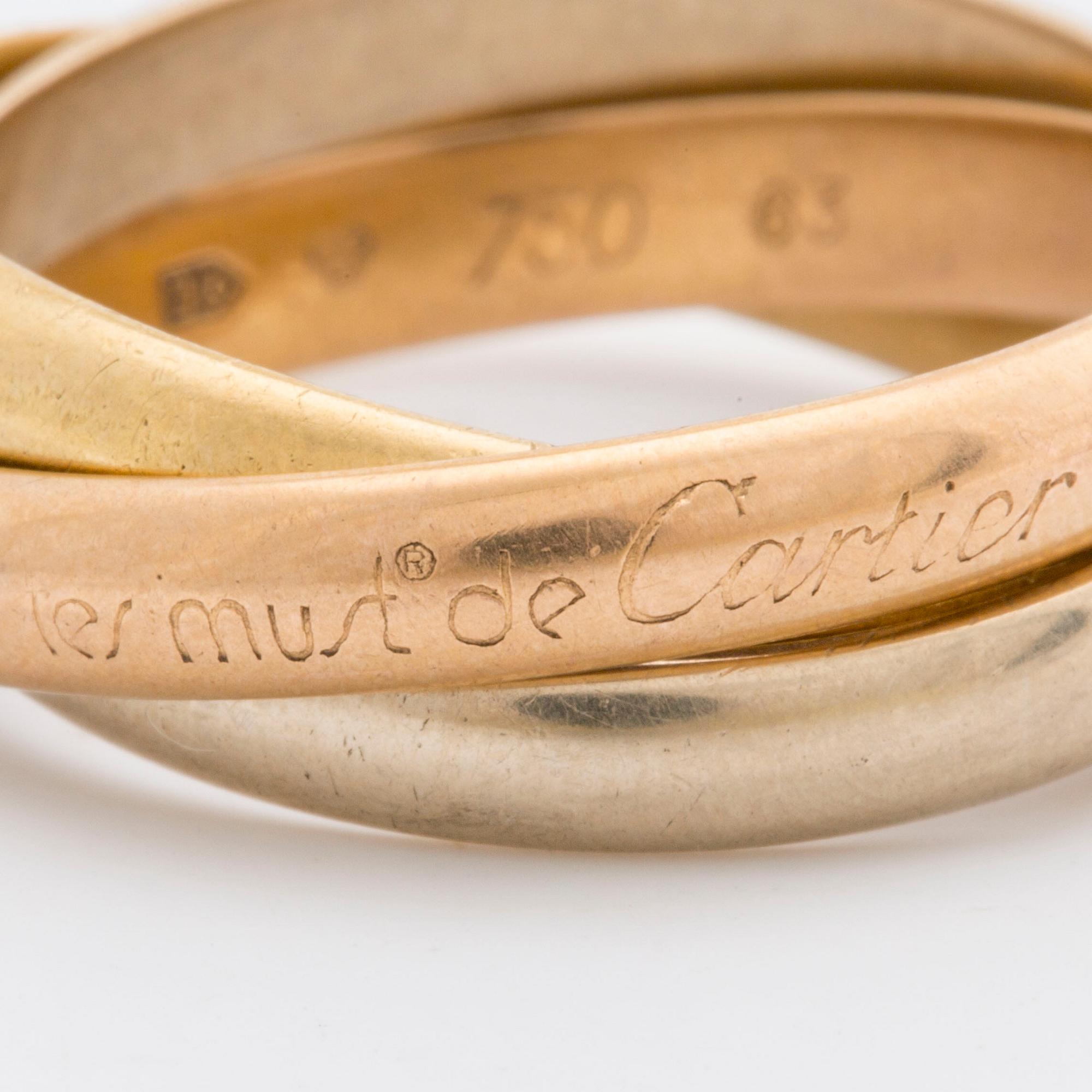 RING "Trinity" Must de Cartier, tri-coloured 18k gold, original case and certifikat.