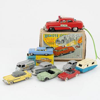 Nine toy cars, mostly Dinky toys.