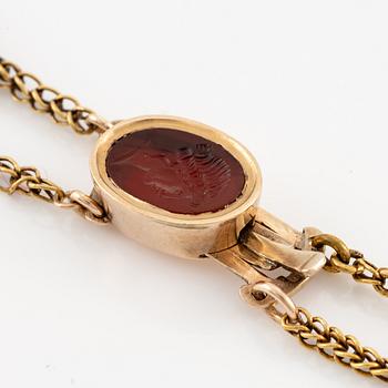 An 18K gold and hardstone intaglio necklace, 19th century.