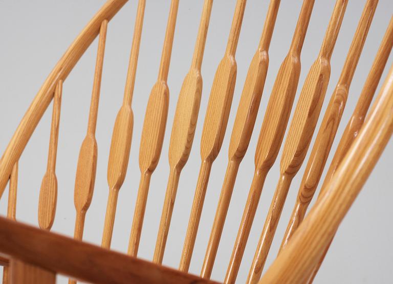 A Hans J Wegner ash and teak 'Peacock chair', Johannes Hansen, Denmark.