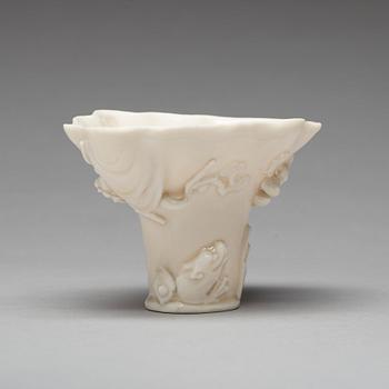 A blanc de chine rhinoserous shaped libation cup, 17th Century.