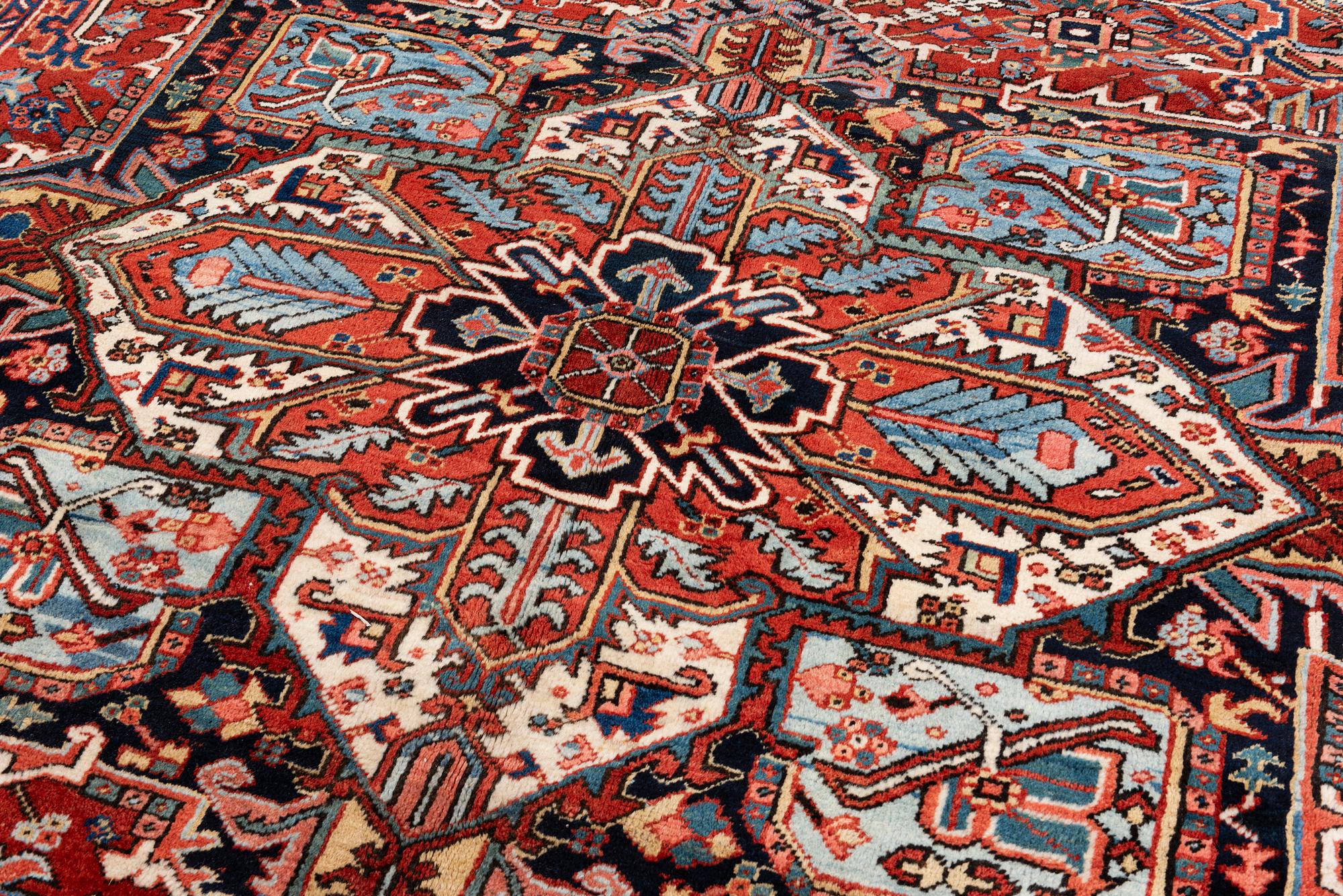 A semi-antique Heris carpet, c. 364 x 299 cm.