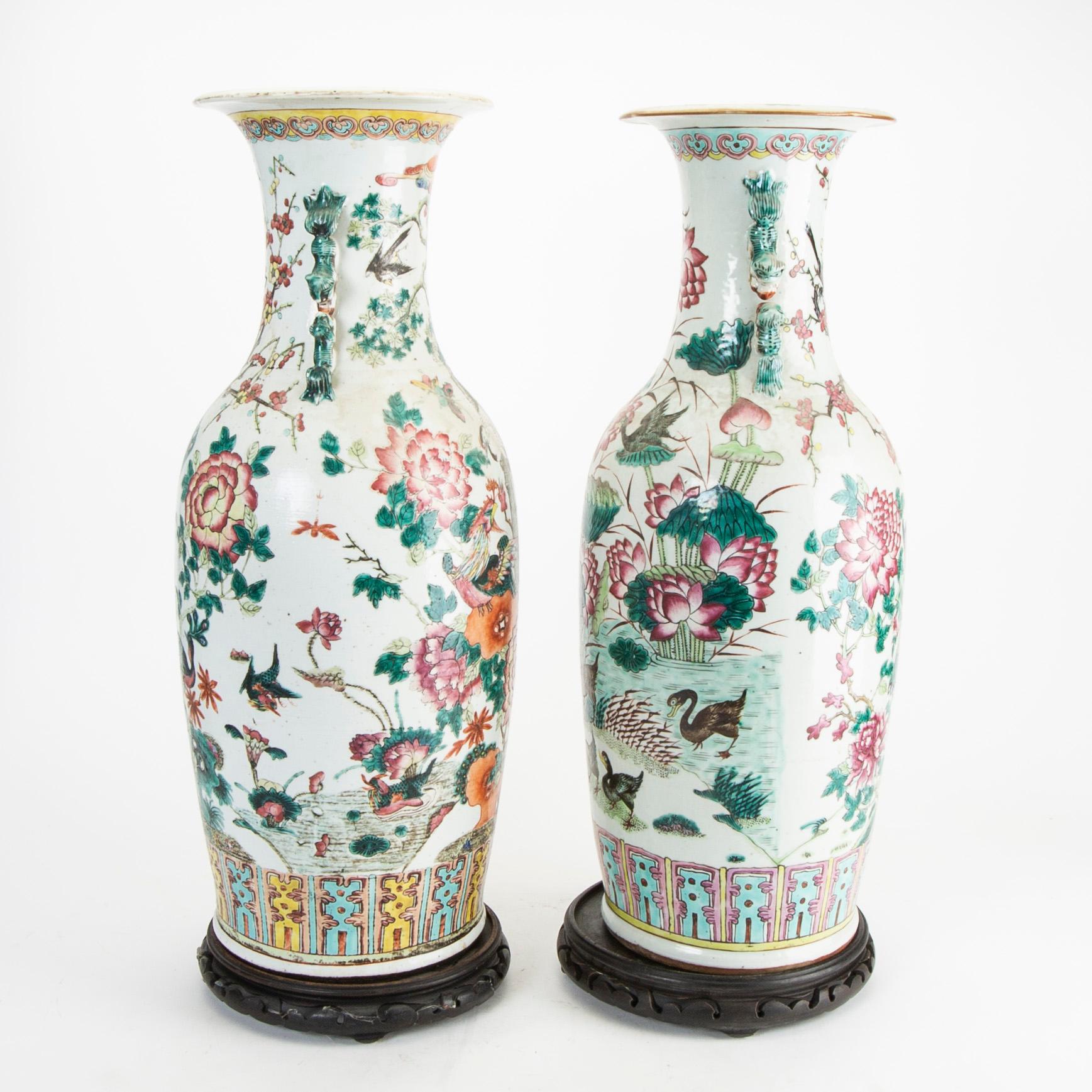 A pair of famille rose vases, late Qing dynasty, circa 1900.