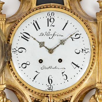 A Gustavian wall clock marked Daniel Herrström (active in Stockholm 1788-1790).