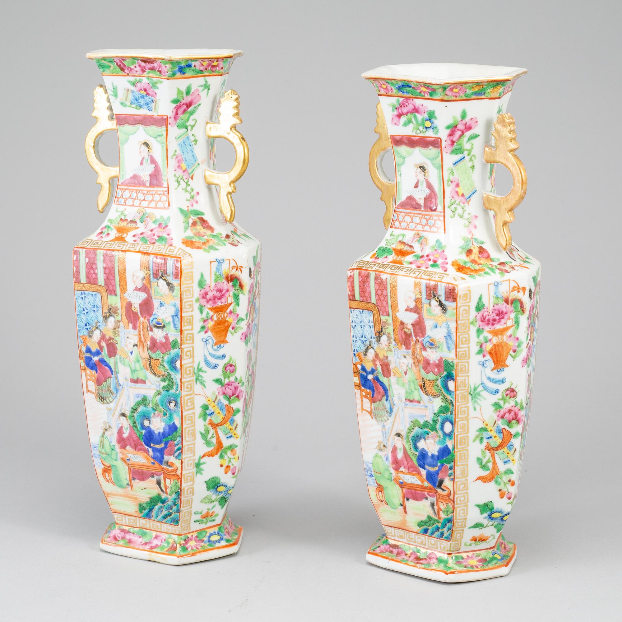 A pair of famille rose canton vases, Qing dynasty, 19th century.