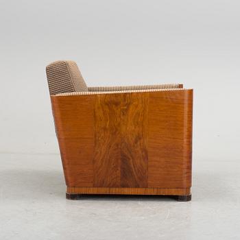 An Art Deco armchair veneered with walnut from the 1930's.