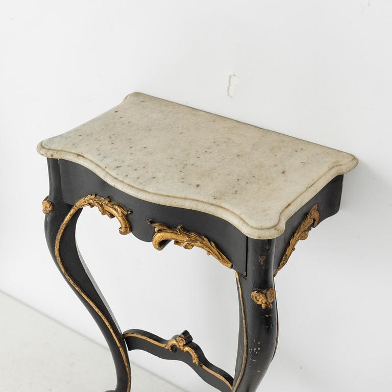A Rococo revival mirror and a console table, second half of the 20th Century.