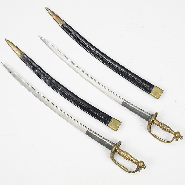 Two Swedish cutlasses 1748-1856 pattern with scabbards.