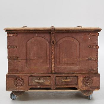 A carved oak chest with wrought iron fittings, 19th Century.