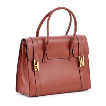397. HERMÈS, a brown leather handbag.