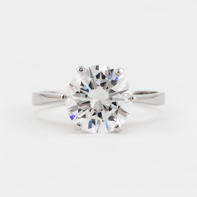 A SOLITAIRE RING set with a round brilliant-cut diamond.