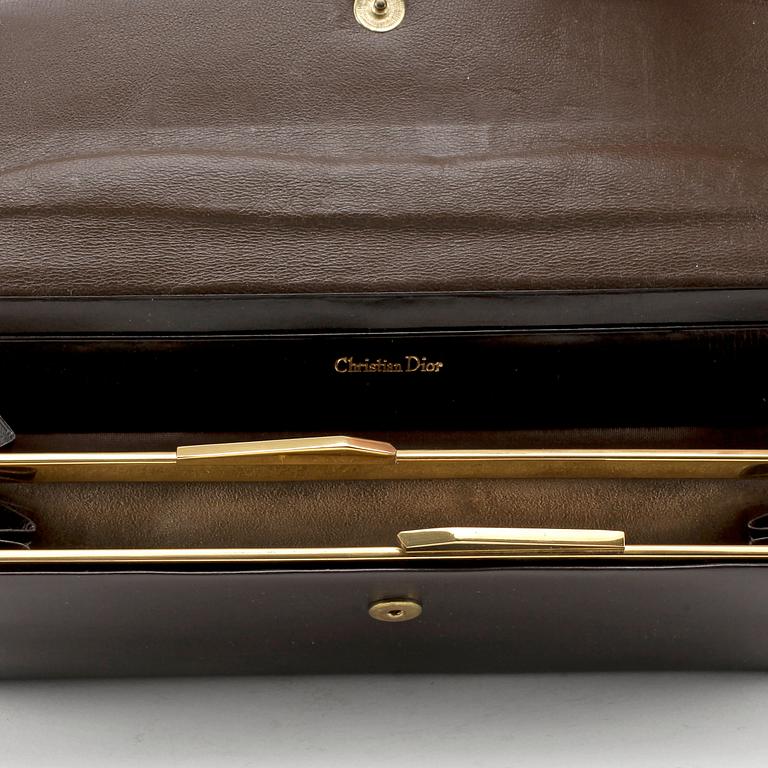 CHRISTIAN DIOR, a brown calf leather clutch / evening bag.