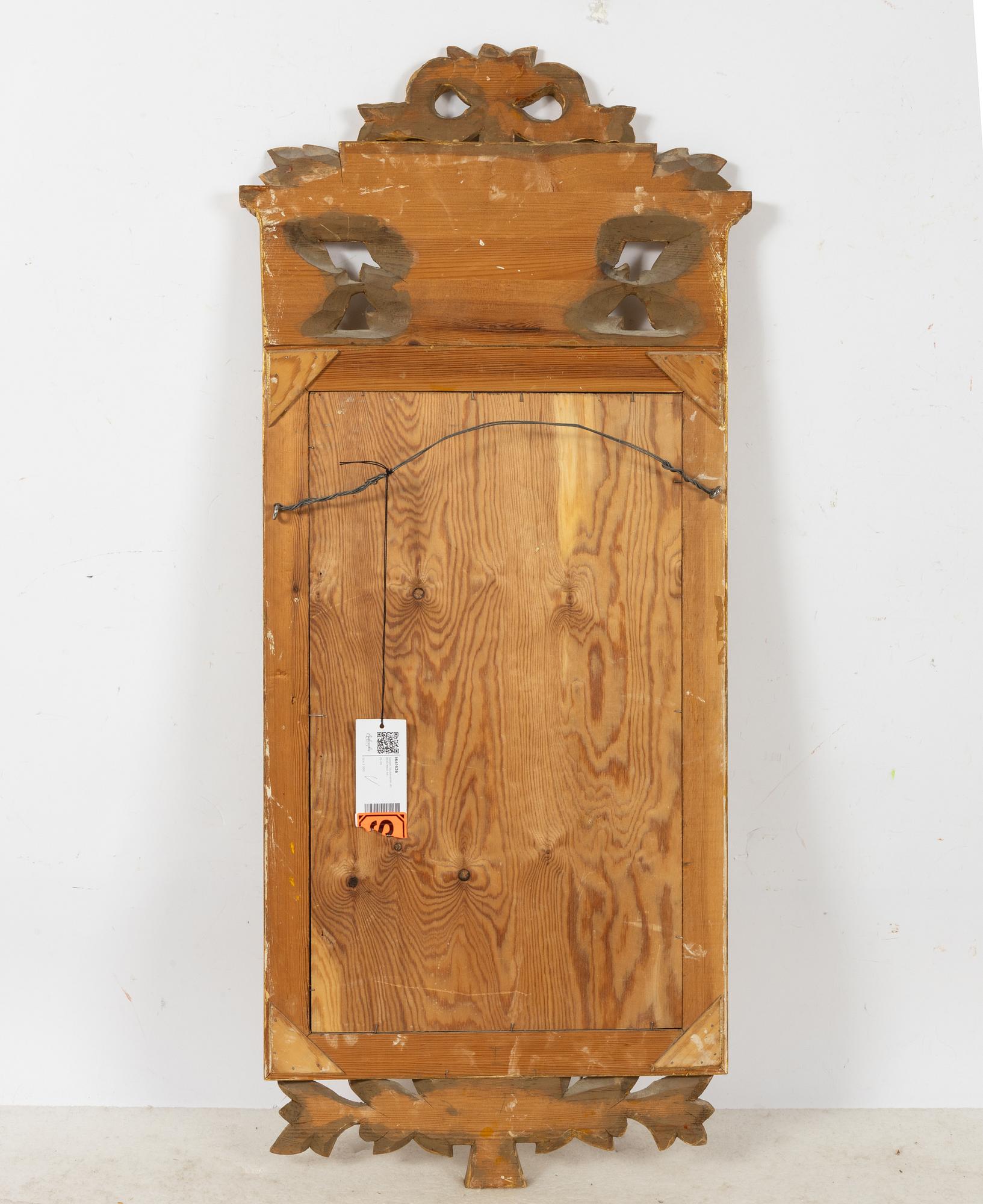 A Gustavian style mirror, circa 1900.