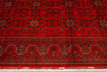 An Afghan rug, c. 298 x 251 cm.