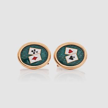 1319. A pair of green, white, red and black enamel cufflinks with a playing-cards motif.