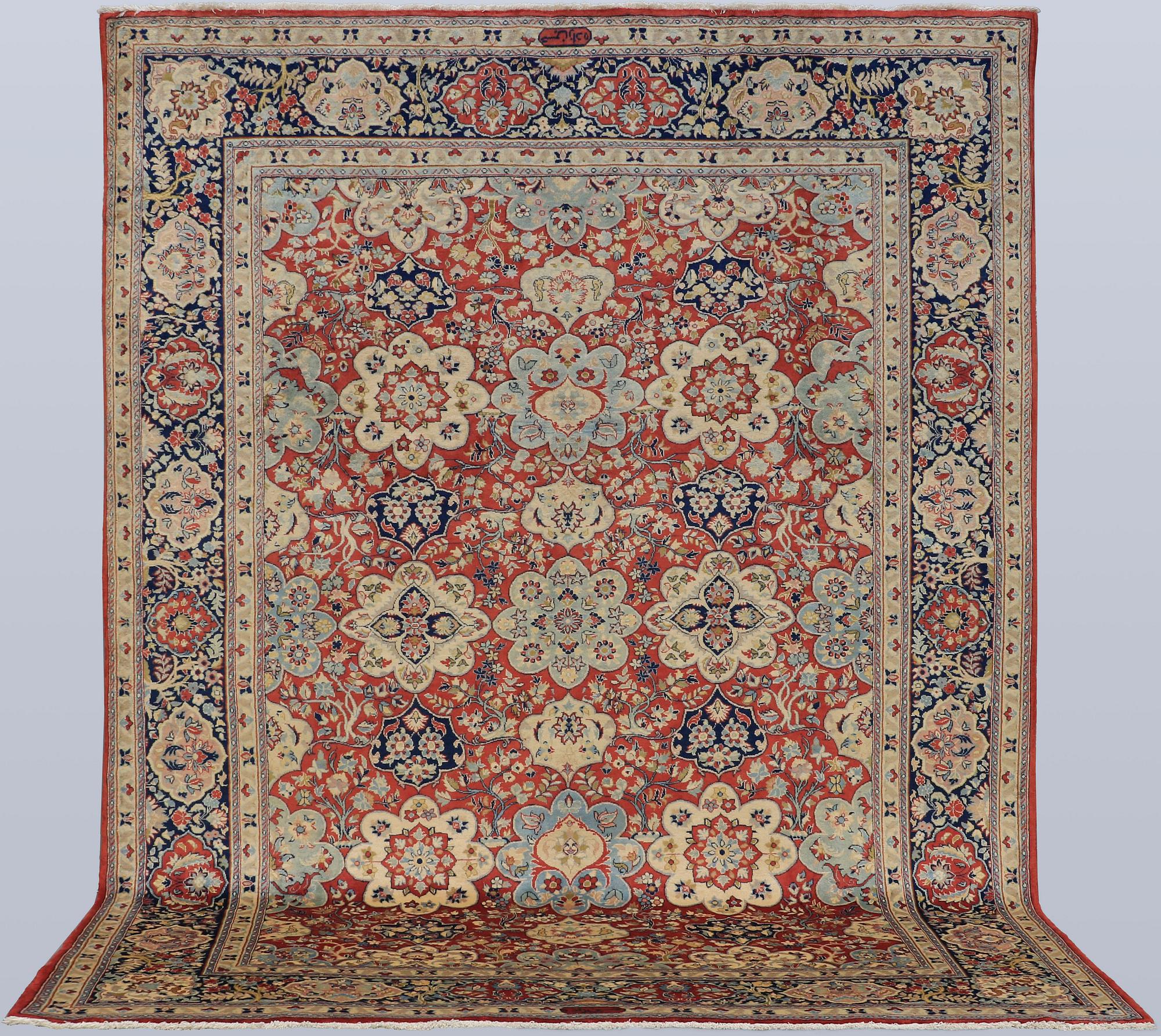 A Sarouk carpet, signed, approx. 327 x 253 cm.