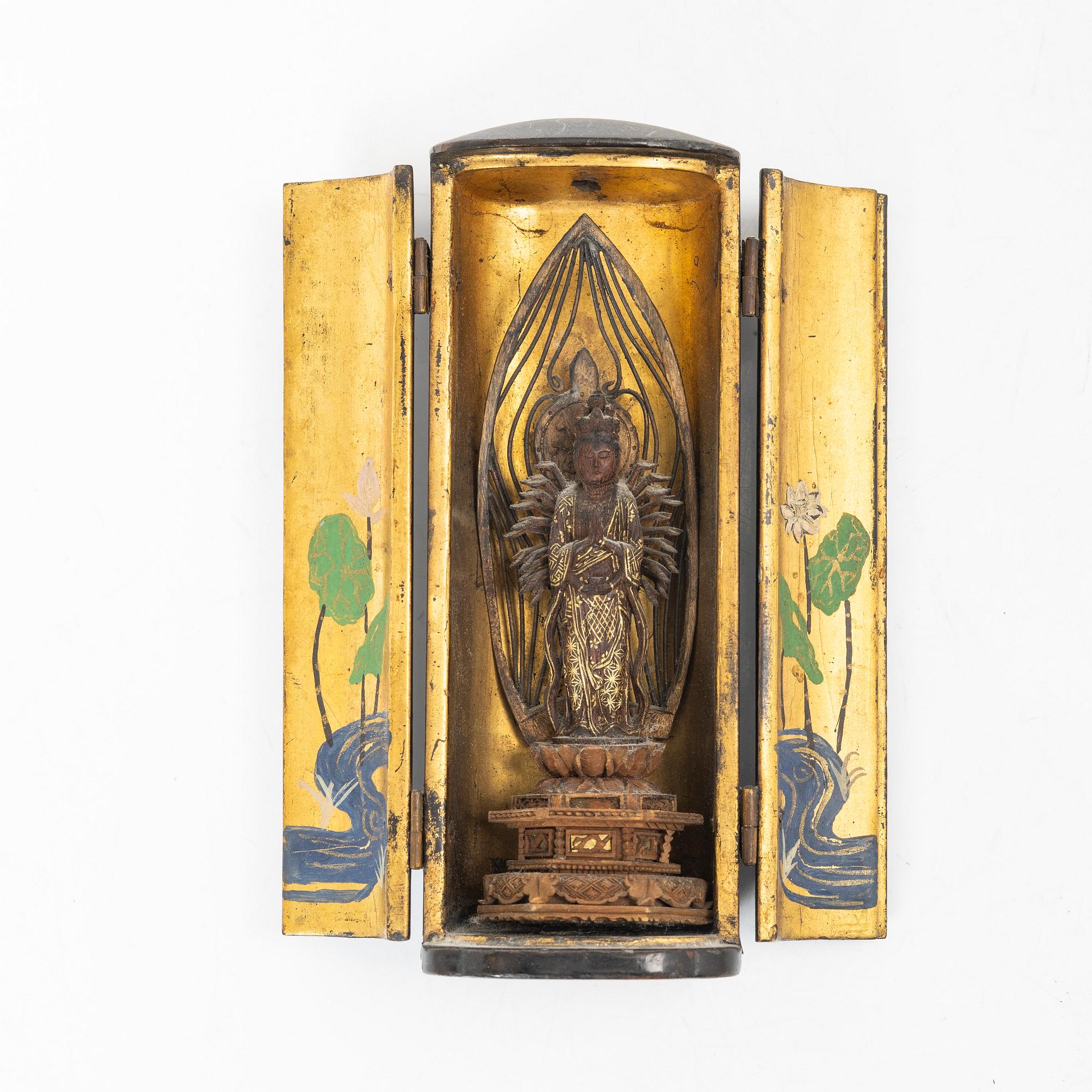 A portable buddhist altar and a figure of 'Weeping Buddha', Japan and Indonesia.