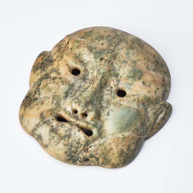 A Japanese sculptured face mask, Edo period (1603-1868).