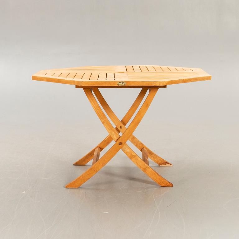 A set of four chairs and a table Royal teak and others, later part of the 20th century.