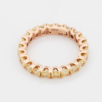 Cushion-cut yellow diamond eternity ring.