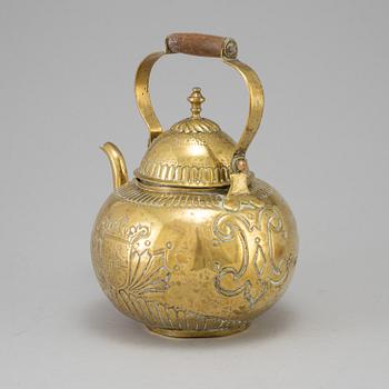 A 18th century brass tea pot.