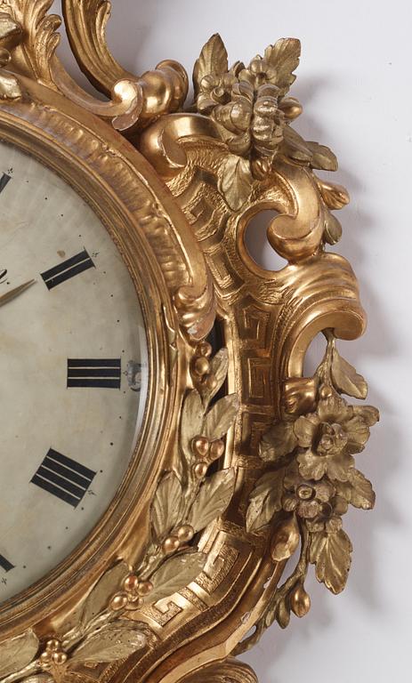A rococo giltwood cartel clock by J. Lindgren (master in Stockholm 1761-62).