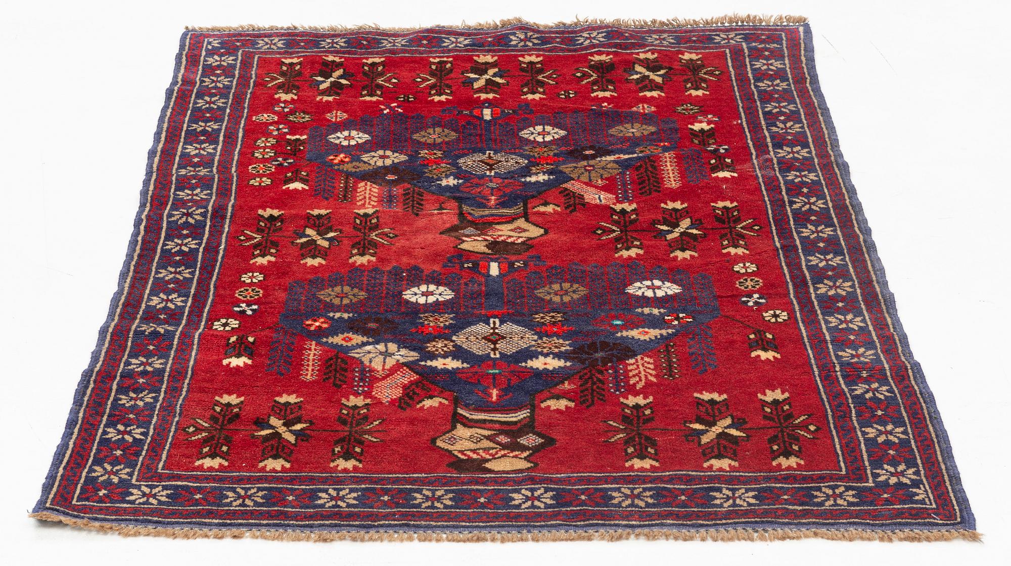 A carpet, circa 133 x 93 cm.