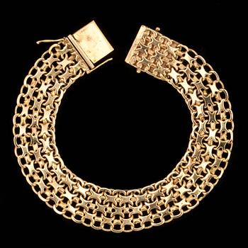 ARMLÄNK, 18 k guld, x-länk. Vikt ca 28 g. Guld- Och Silversmedjan H Svensso, 1961.