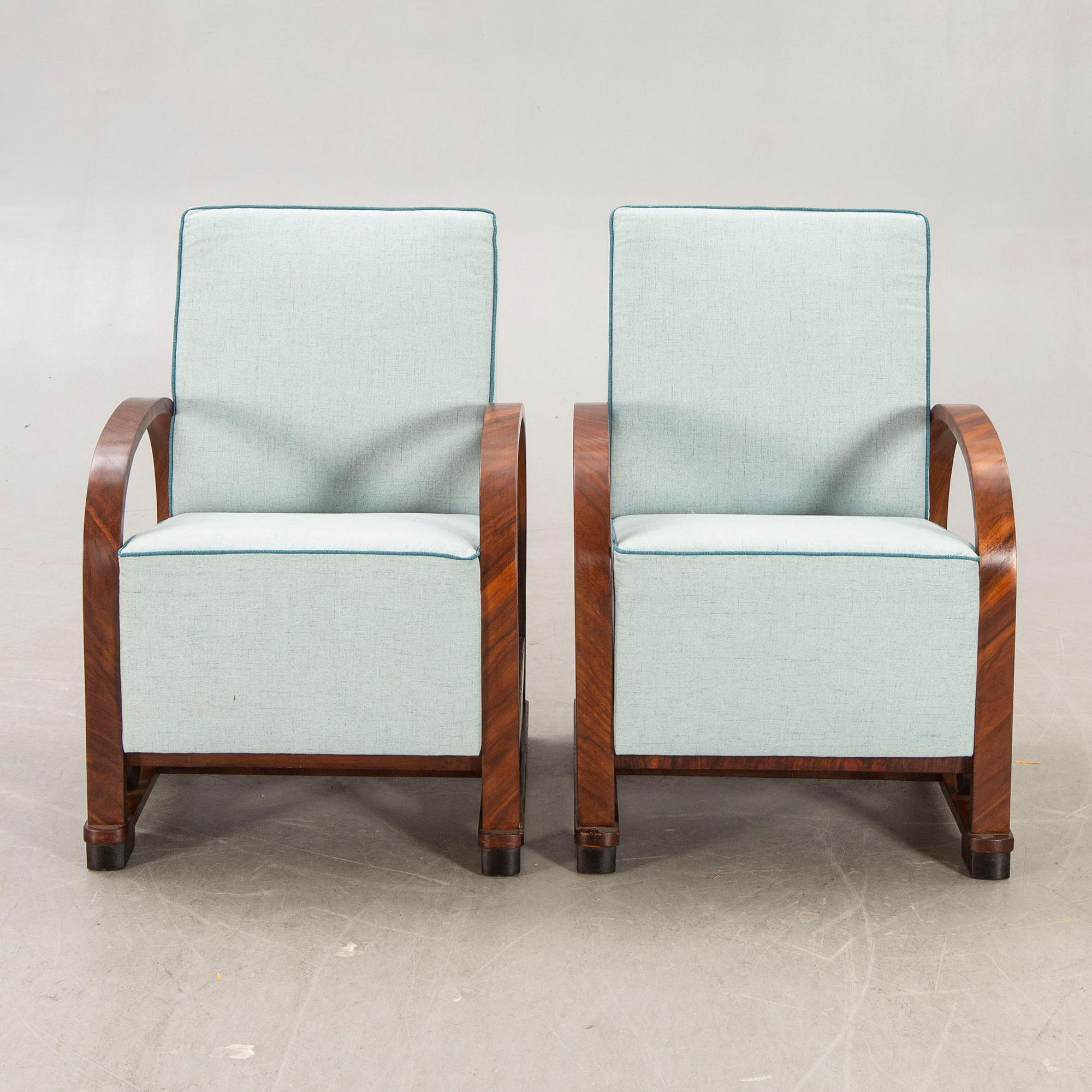A pair of Art deco walnut armchairs first half of the 20th century.