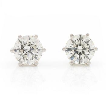 Earrings, single-stone earrings in 18K white gold with brilliant-cut diamonds.