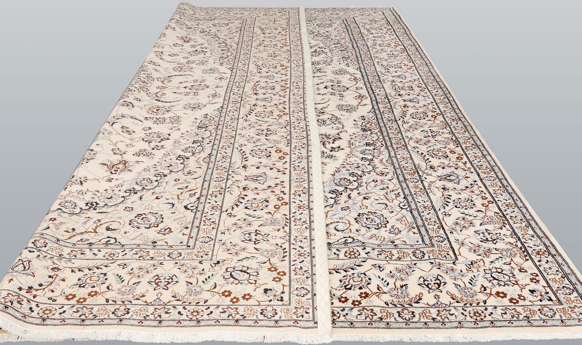 A Nain part-silk carpet, 395 x 293 cm.