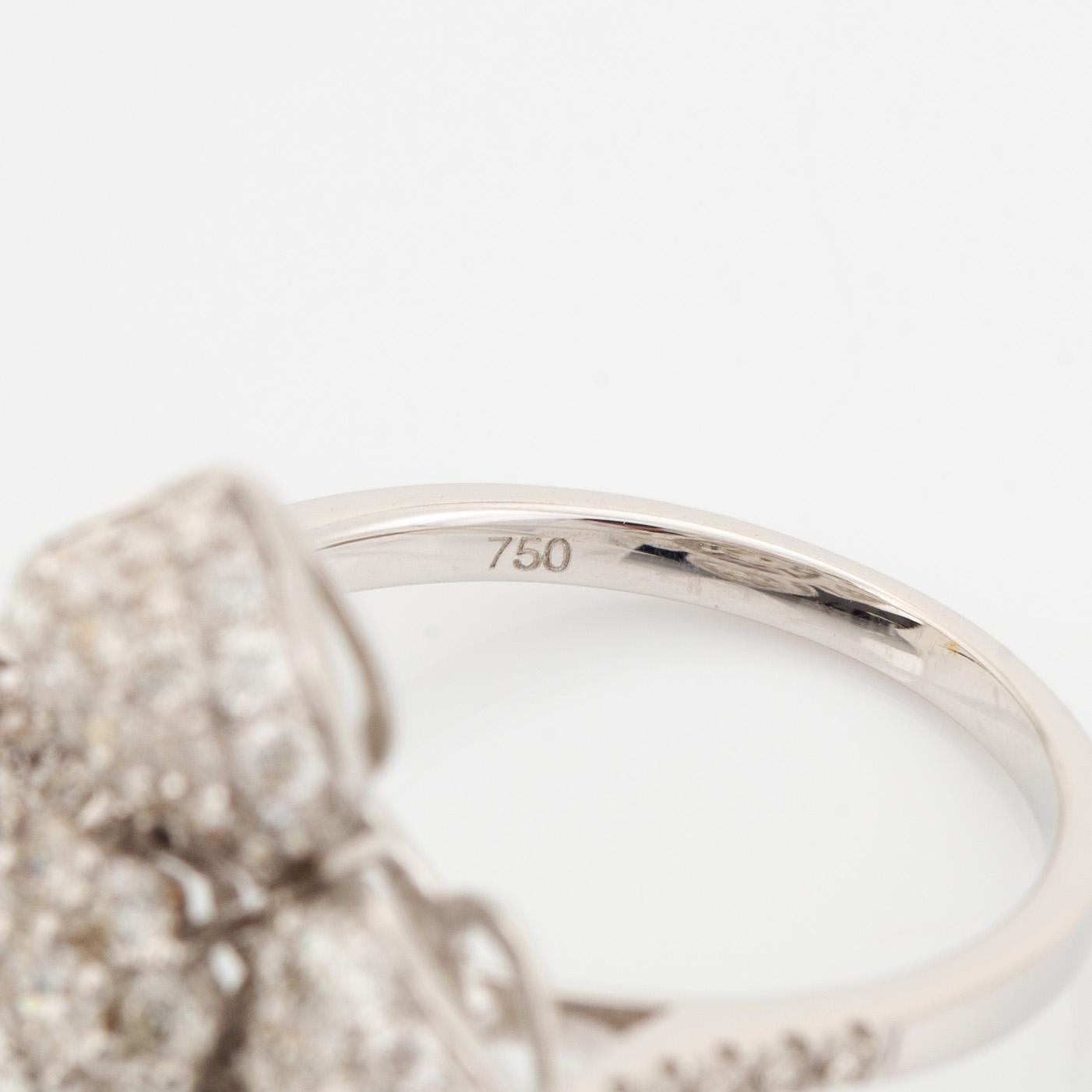 Brilliant cut diamond flower ring.