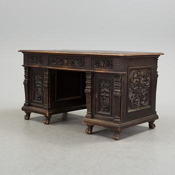 A Renaissance revival free standing writing desk, late 19th century.