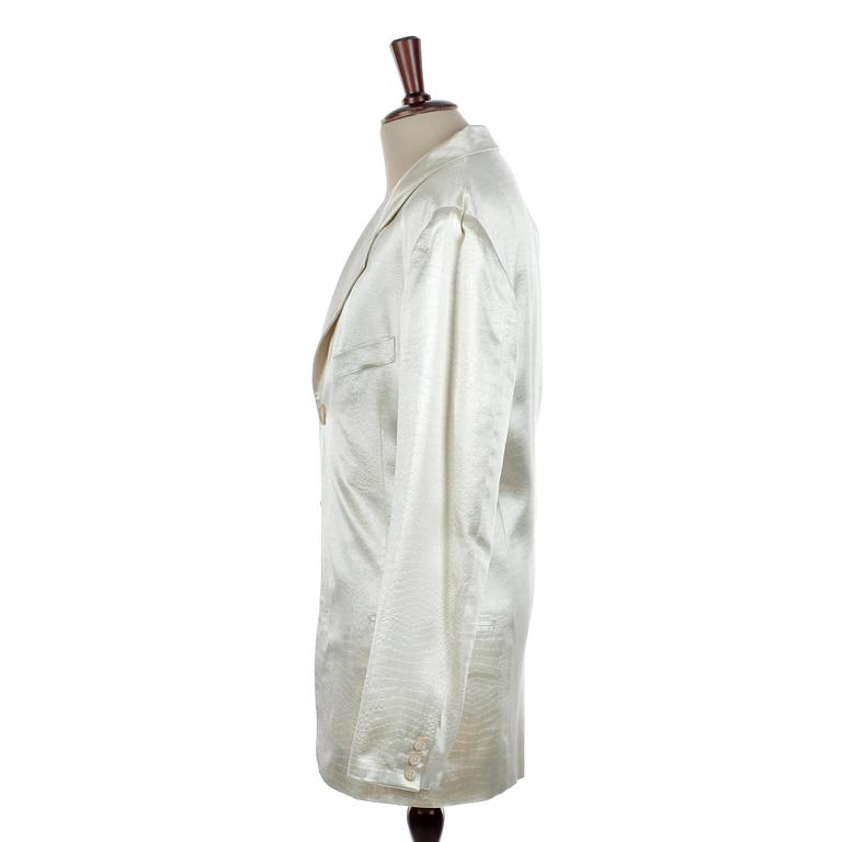 DOLCE & GABBANA, a creamecolored crocodile embossed men´s evening jacket, size 48.