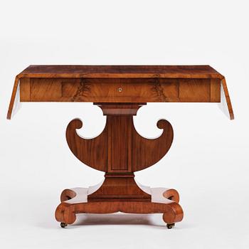 A Swedish Empire mahogany center table.