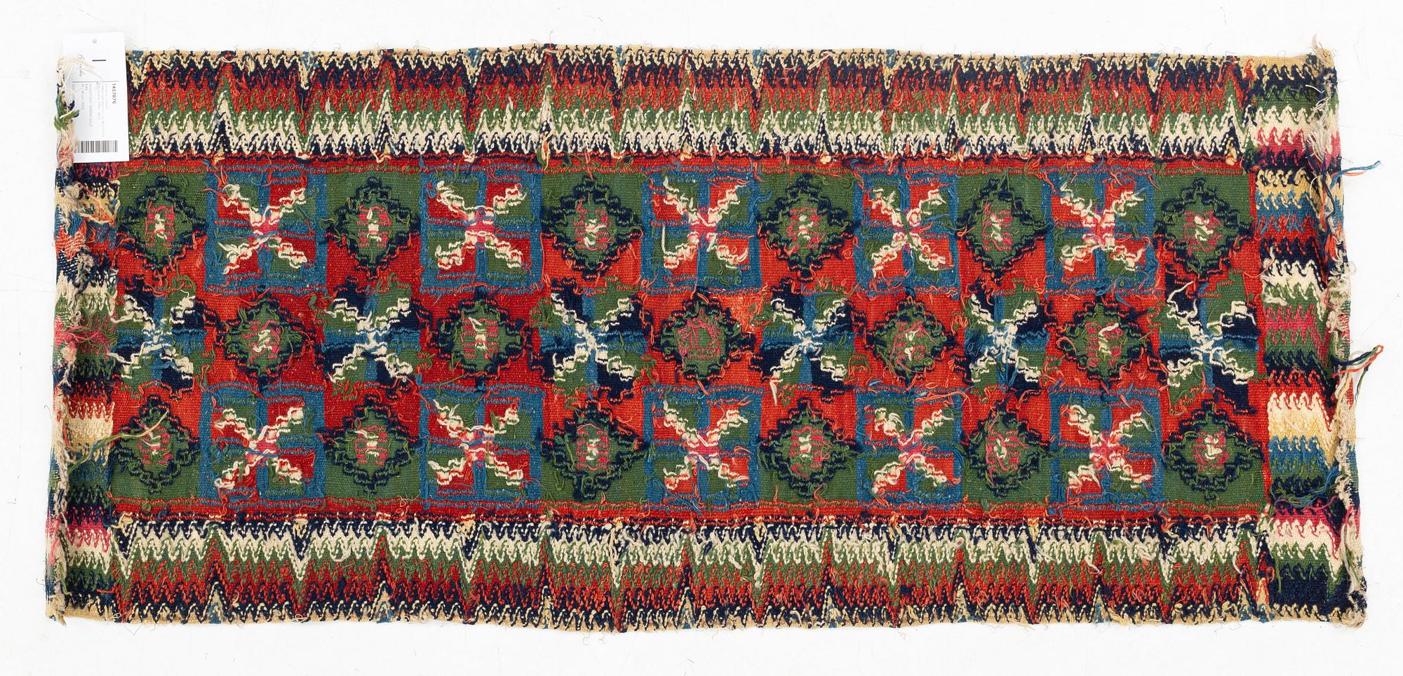 A carrige cushion, "Åttabladsstjärnor", flat weave, ca 46,5 x 104 cm, Scania, 1780 to 1820.