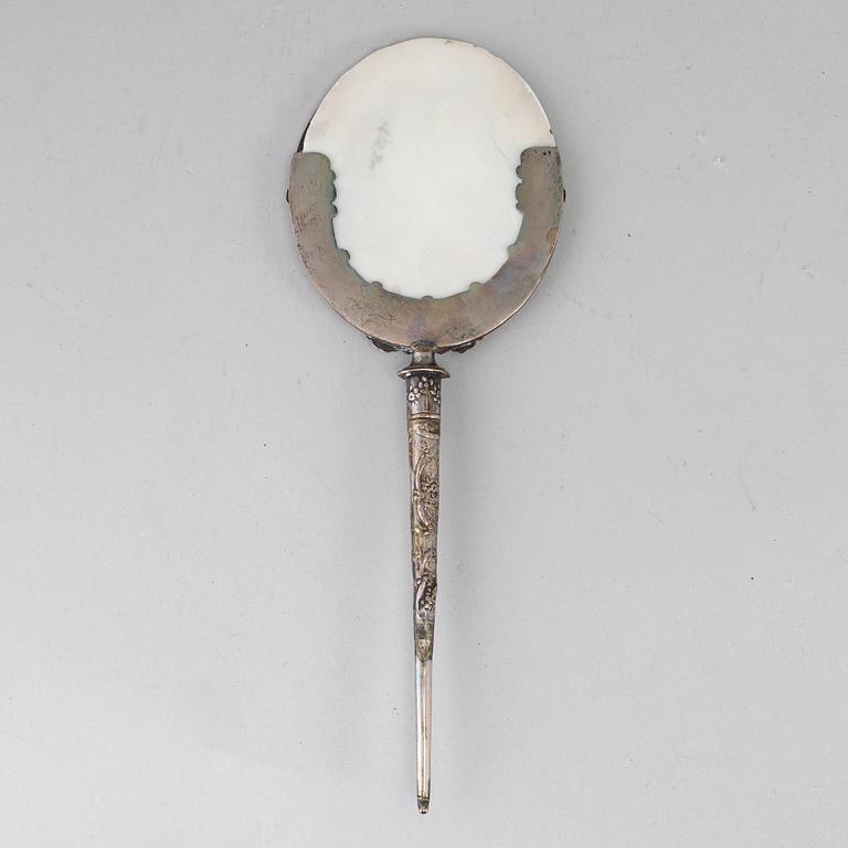 A 19th century silver candle shade.