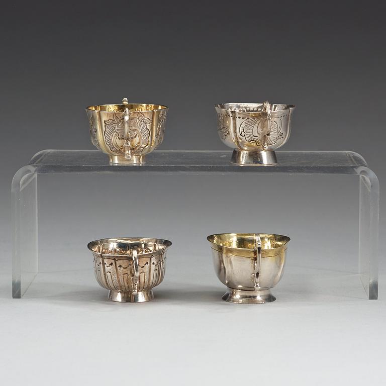 Four Russian 18th century parcel-gilt vodka-cups, three unmarked.