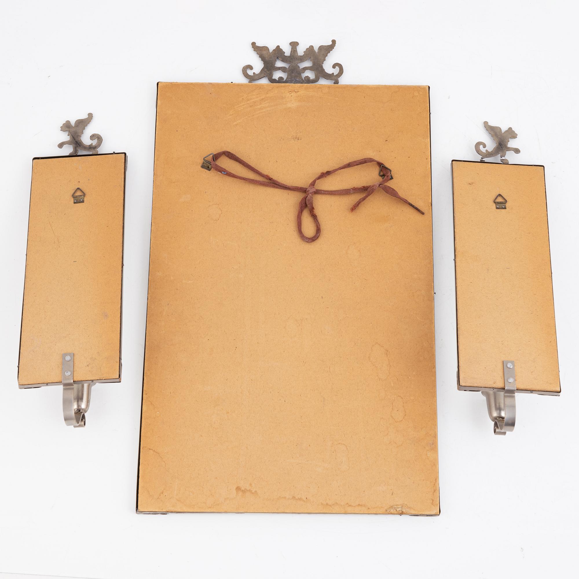 A Swedish Grace mirror and a pair of wall sconces, 1920's/30's.