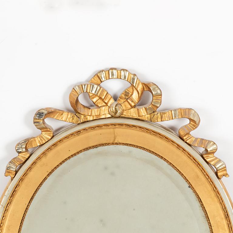 A gustavian style mirror, first half of the 20th century.