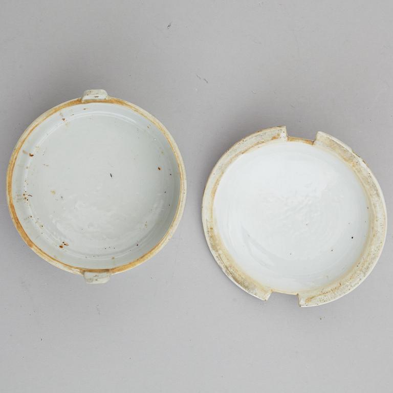 A famille rose butter tureen with cover and two cups with three odd stands, Qing dynasty, Qianlong (1736-95).