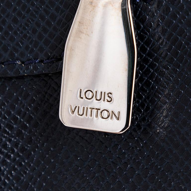 Louis Vuitton, a Navy Taiga 'Sasha' Messenger bag.