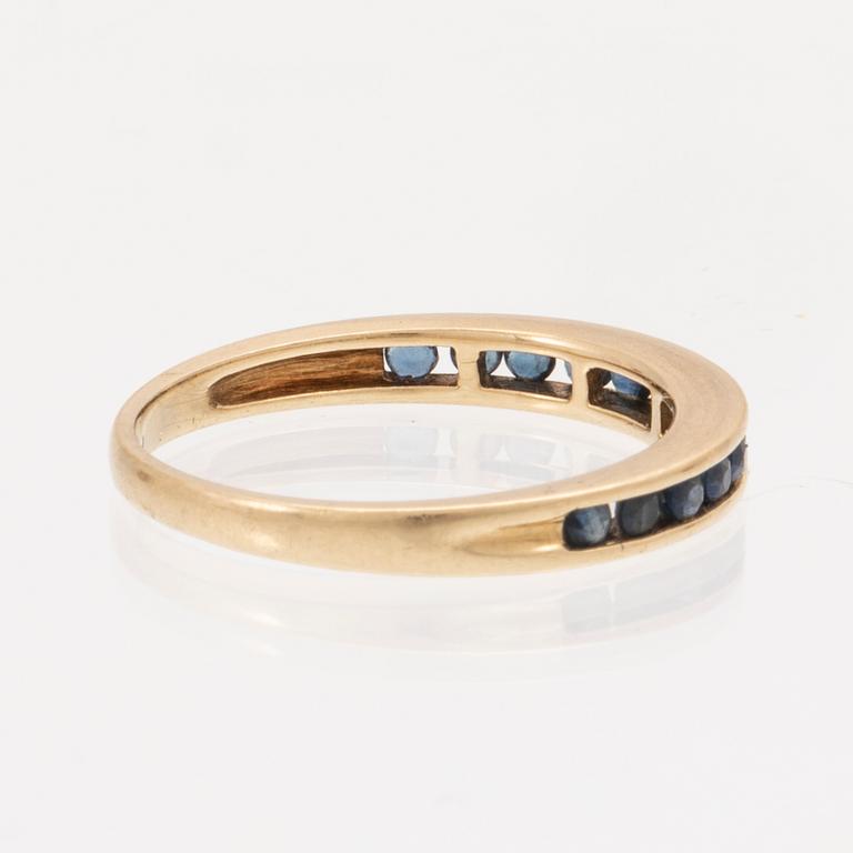 An 18K gold ring and a pair of earrings by H. Stern set with round brilliant cut diamonds and sapphires.