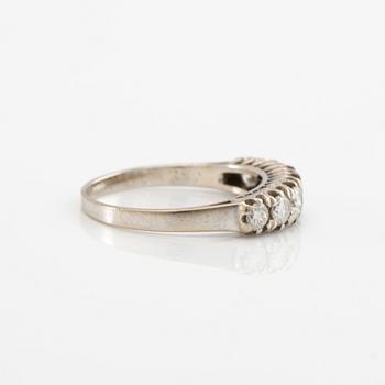 Half-eternity ring in 18K white gold set with round brilliant-cut diamonds, approximately 0.93 ct in total.