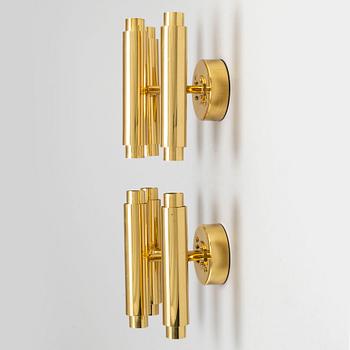 HANS-AGNE JAKOBSSON, a pair of 'Prelaten' brass wall lights designed in 1989.