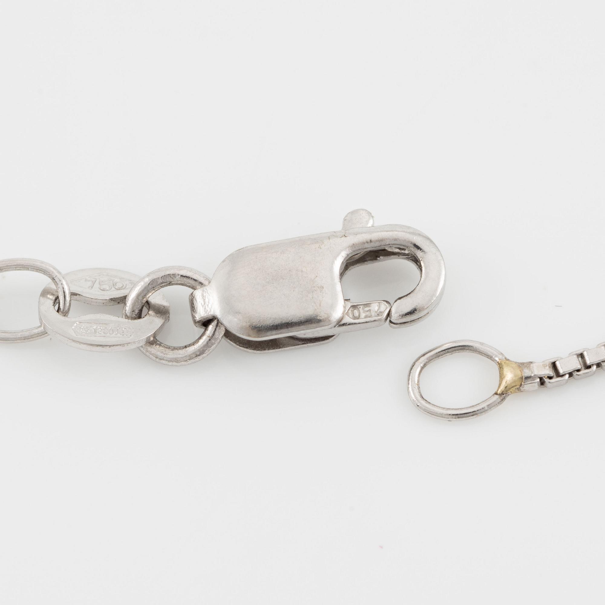 Pendant with 18K gold chain featuring a faceted sapphire and round brilliant-cut diamonds.