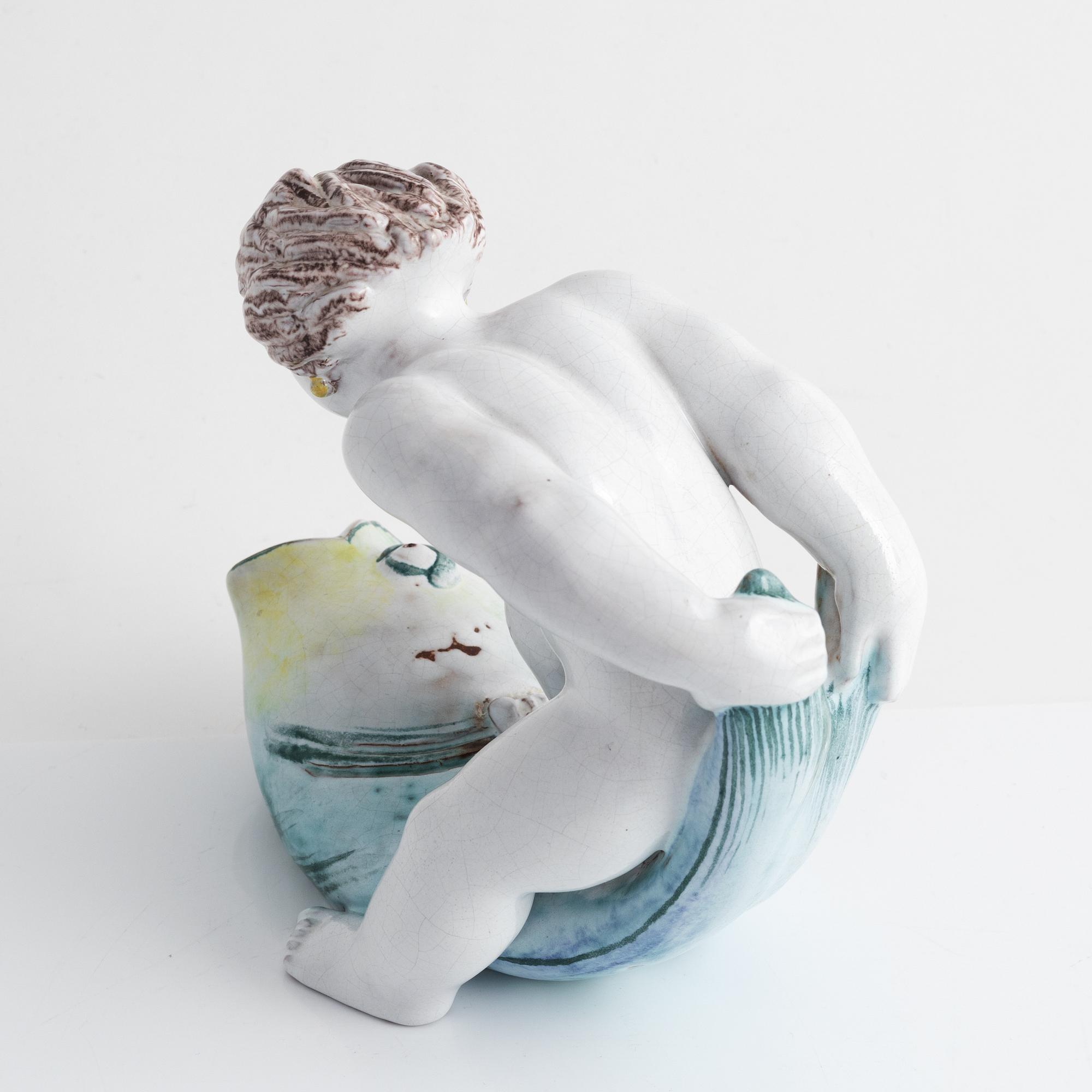 Tyra Lundgren, a faience figurine, Rörstrand, dated -30.