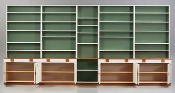 A Josef Frank set of five walnut and white lacquered bookshelves, Svenskt Tenn, model 2255.