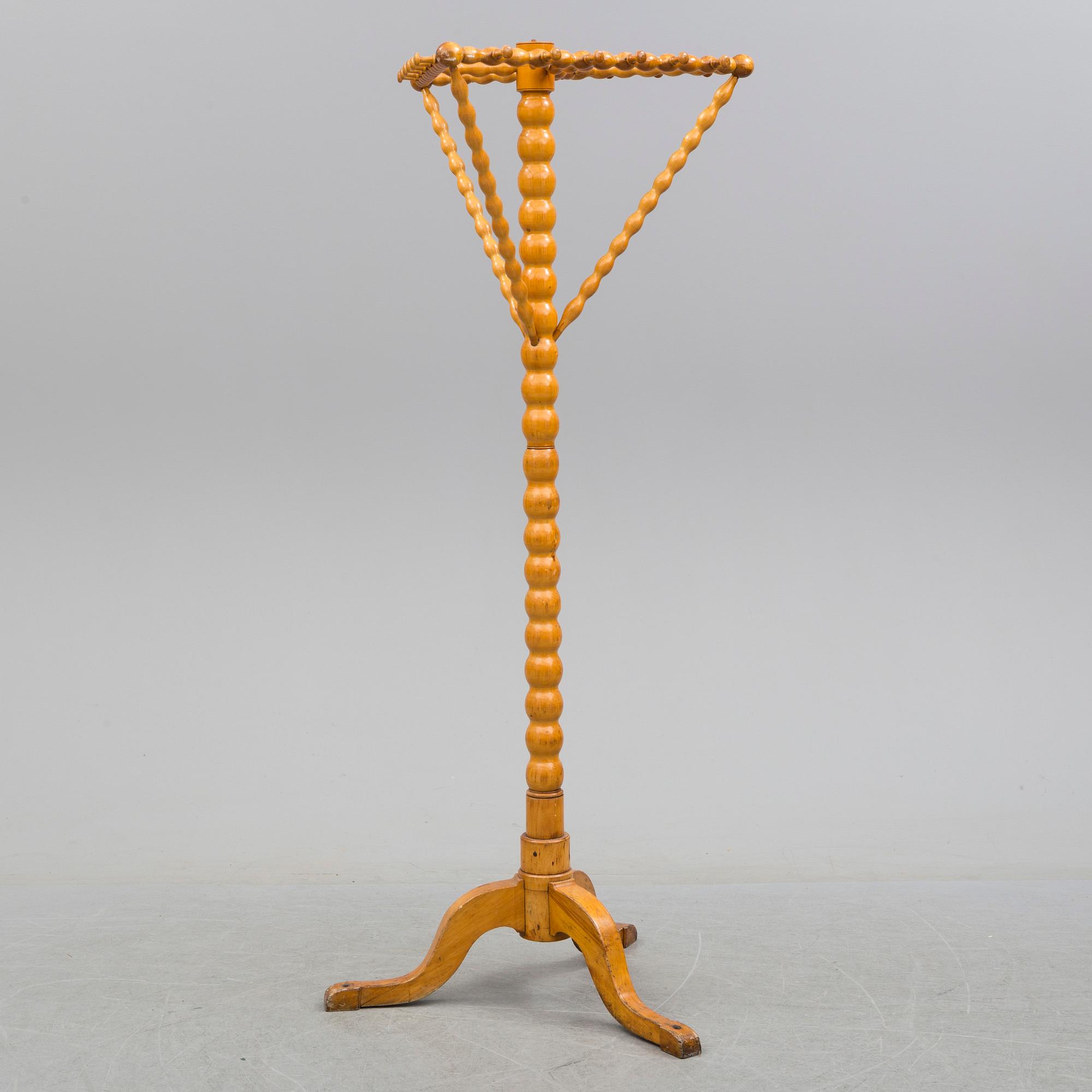 A turned birch clothes hanger, circa 1900.