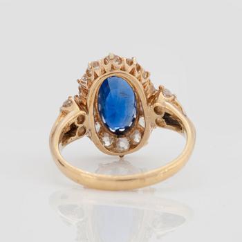 A RING set with a mixed-cut sapphire.